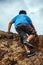 Young Man Climbing a Mountain