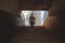 Young man climbing stairs in pedestrian subway