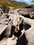 Young man climbs on boulders rocks in The Moon Valley, Chapada dos Veadeiros, Brazil