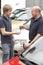 Young man collecting new car