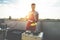 Young man cooking meat on barbecue - Chef serving pork ribs from grill house patio terrace outdoor - Summertime, food and outside