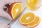 Young man cutting oranges.