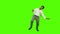 Young man dancing against green background