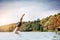 Young man diving into a lake.