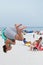 Young Man does a backflip on the sand at Pensacola Beach, Florida
