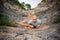 Young man doing an ashtavakrasana. Hand standing