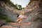 Young man doing an ashtavakrasana. Hand standing