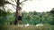 Young man doing backflip off rope swing