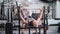 A young man doing bench press exercise in the gym.