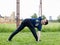 Young man doing an exercise in the city park