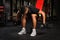 Young man doing Seated Bent Over Dumbbell Reverse