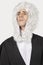 Young man dressed as judge against gray background