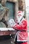 Young man dressed up as santa preparing to throw a snowball, during charity event Stockholm Santa Run in Sweden