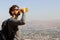 Young man drinking bottle of water outdoors