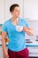 Young man drinking coffee in the kitchen portrait format morning