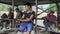 Young man driving a small ferry boat on mekong river 