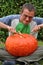 Young man eating his huge pumpkin