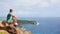 Young man enjoying breathtaking views from Shirley Heights on Antigua island