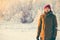 Young Man enjoying snow weather walking Outdoor