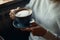 Young man enjoying yummy flat white , coffee