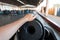 Young man enjoys riding in an electric bumper car on an autodrome in an amusement park. Closeup of male hand on steering wheel