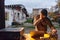 A young man is entertaining a group of friends in the backyard of his house, becoming their DJ and playing music in a