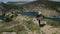 A young man escapes from a mountain to meet a beautiful landscape