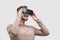 Young man experiencing virtual reality eyeglasses headset. Handsome men using vr glasses. Future, gadgets, technology concept