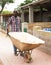 Young man farmer with barrow during working at farm