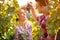 Young man feed his girl with grapes