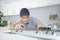 Young man fitting kitchen hob