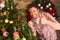 Young man fixing Christmas tree lights