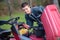 Young man fixing tractor