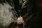 A young man geologist explores a mountain cave, travel concept