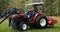 A young man gets into a tractor and starts driving, getting ready for work