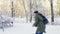 Young man getting snowball on body and head