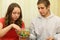 Young man and girl eating candy colored glass bowl