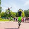 a young man and a girl jump on jumpers on the Volga embankment on a summer sunny day