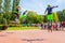 a young man and a girl jump on jumpers on the Volga embankment on a summer sunny day