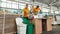 Young man and girl sorting on waste dumping station