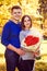 A young man gives a bouquet to his woman