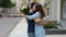 Young man giving bunch of flowers to girl on date