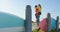 Young man giving woman piggyback on beach 4k