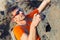 Young man in glasses with backpack climbing