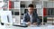 Young man gray jacket sitting at table in white office and offering documents