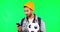 Young man, green screen and phone with football, texting and communication with reading in studio. Student guy