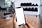 Young man Hand holding smartphone in gym to fitness phone fitne