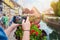 Young man hands holding smartphone and taking photo picture of beautiful town Colmar, France