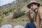 Young man in Hat starting an adventure in the mountain in Montenegro