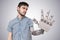 Young man have robotic hand as a replacement for his hand. 3D rendered illustration of hand